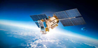 Satellite orbiting Earth with moon in background