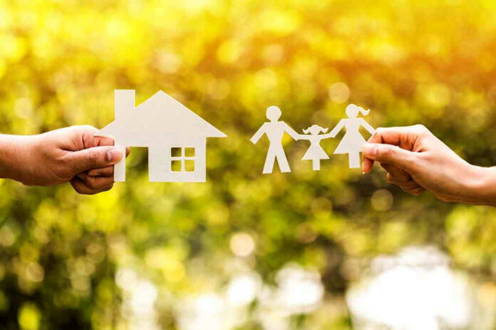 543106639 Paper cutouts of a house and family outdoors