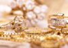 Close up of various gold rings adorned with sparkling gems