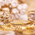 Fusion-Powered Gold: Will It Upend Global Markets? Close up of various gold rings adorned with sparkling gems