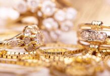 Close up of various gold rings adorned with sparkling gems