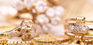 Close up of various gold rings adorned with sparkling gems