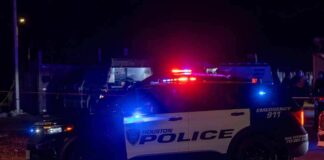Houston police vehicle with emergency lights activated at night