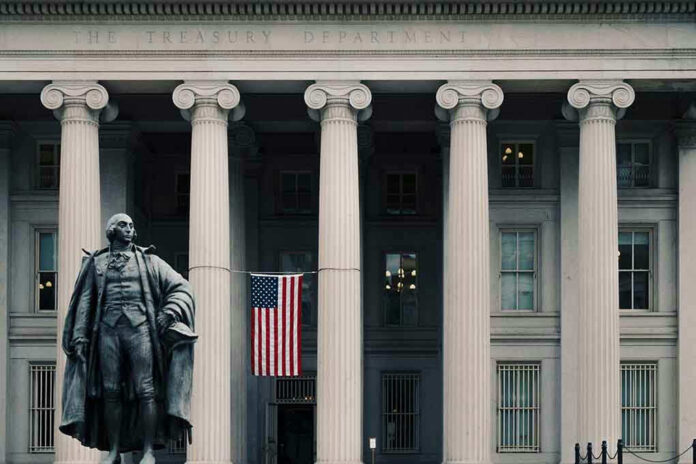 1240657660 US Treasury Department building with statue and flag.