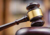 Judge's gavel striking a sound block