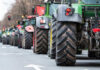 Tractors lined up on a city street