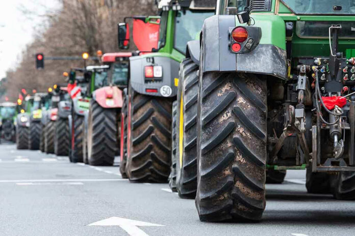 Tractors lined up on a city street