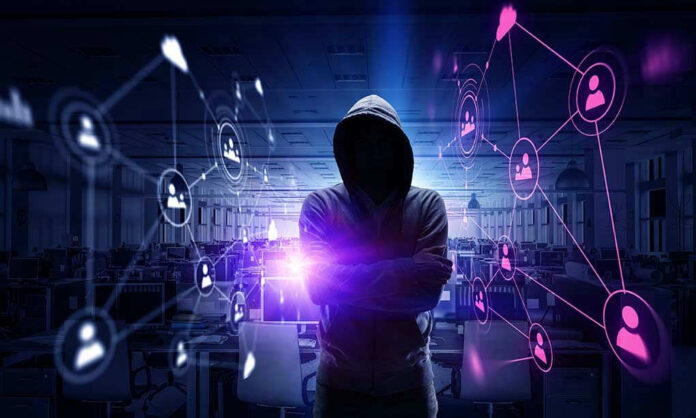 Hacker in hooded sweatshirt with digital connections overlay