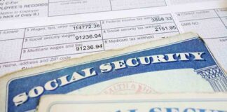 Close-up of social security cards and tax documents showing financial information