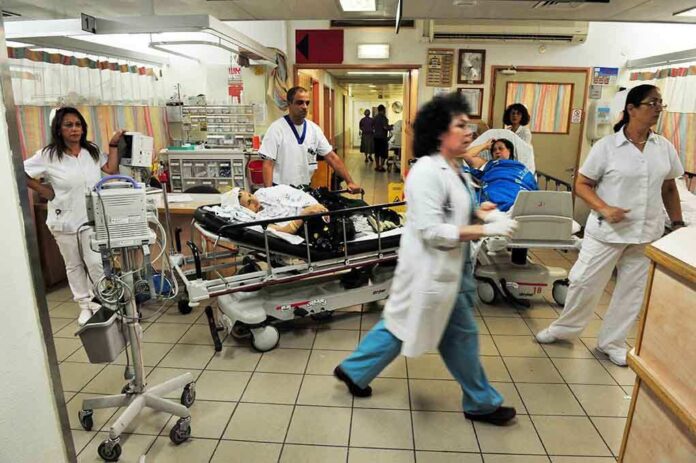 shutterstock_144372544.jpg Medical staff attending to patients in a busy hospital emergency room