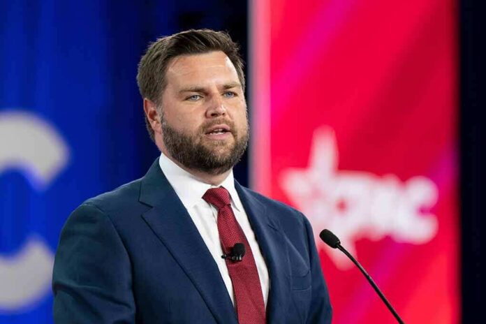 shutterstock_2186937099 (6).jpg A man in a suit speaking at a podium during a conference