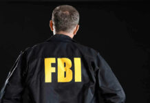 FBI agent with back facing the camera.
