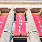 Exterior view of a television studio featuring large banners for Jimmy Kimmel Live