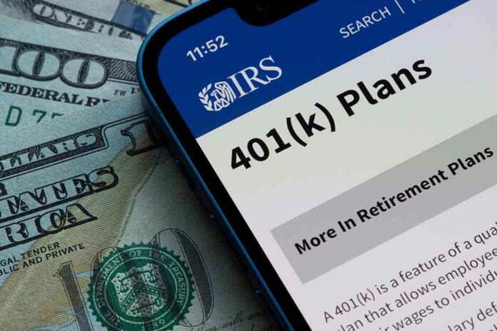 Mobile phone displaying IRS information about 401(k) plans on a background of cash