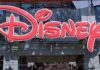 Bright red Disney logo displayed on a storefront window