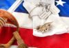 Military items including a sword, gloves, dog tags, and an American flag