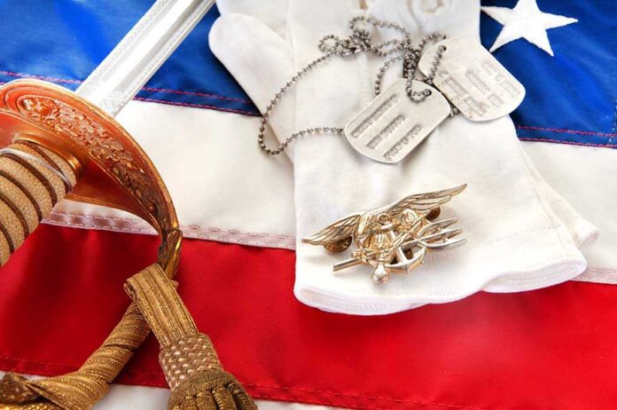 Military items including a sword, gloves, dog tags, and an American flag
