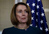 Wiener Challenges Pelosi—Broke His Pledge Person standing in front of an American flag.