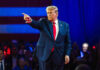 Trump’s Issues SHOCKING Repatriation Orders Person in suit pointing during a public event.