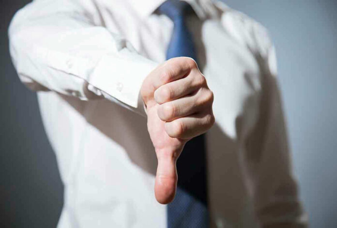 314376254 Person giving a thumbs down gesture.