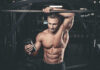 Fitness Influencers Send Americans to ER Muscular man in gym holding a shaker bottle
