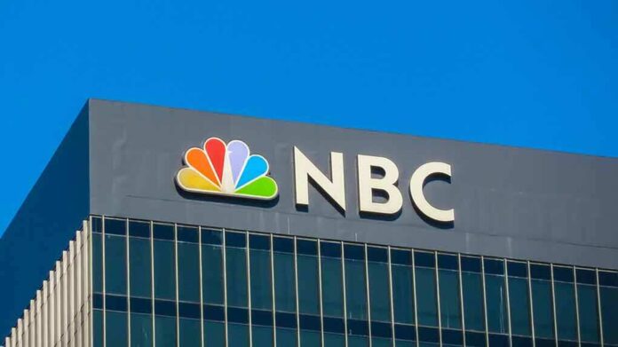 shutterstock_1211618743 (1).jpg NBC logo displayed on a corporate building against a blue sky