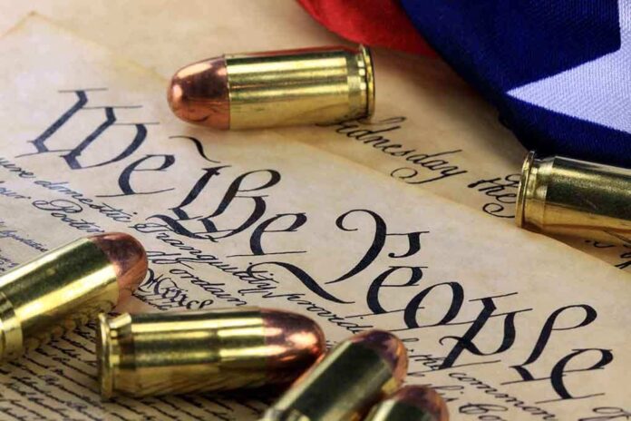 shutterstock_170423123.jpg Close-up of bullets surrounding a historical document with the phrase We the People