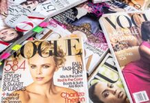 A collection of Vogue magazines featuring various covers and celebrity portraits