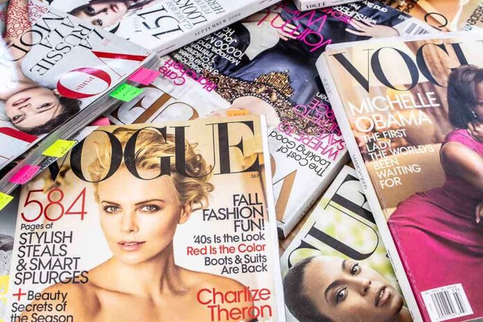 A collection of Vogue magazines featuring various covers and celebrity portraits