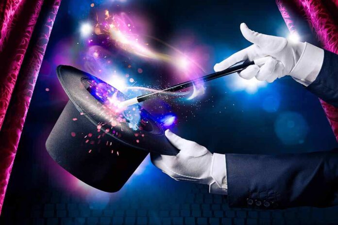 shutterstock_214419160.jpg A magician performing with a top hat and wand, creating magical effects