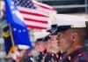 Marine Veteran Gunned Down By Teens in COLD BLOOD U.S. Marines in uniform standing in formation with flags in the background