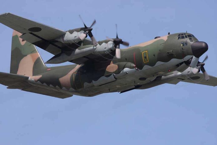 shutterstock_44660152.jpg Military C-130 Hercules aircraft flying against a blue sky