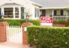A house with a For Rent sign in the front yard