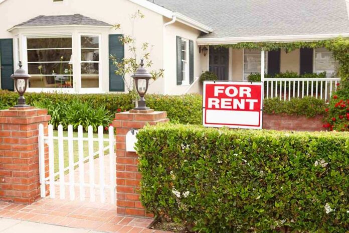 shutterstock_84704458.jpg A house with a For Rent sign in the front yard