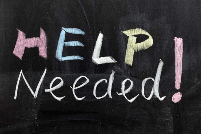 shutterstock_94485058.jpg Chalkboard with the words HELP NEEDED! written in colorful chalk