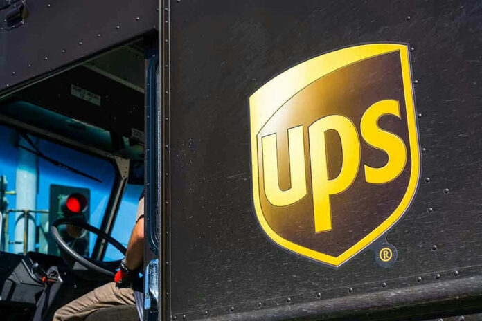 1073314271 UPS delivery truck with driver inside cab