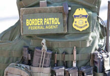 MASSIVE Meth Bust — BIZARRE Hiding Place REVEALED! Border Patrol vest with gear and communication equipment.