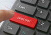 Finger pressing ERASE PAST key on keyboard.