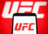 UFC logo on phone screen and background.