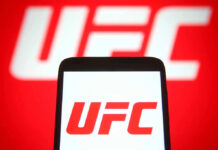 UFC Star AXED After Match-Fixing Allegation UFC logo on phone screen and background.