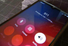 $450 Million Disaster—911 Lifeline Crumbles Phone screen showing 911 emergency call in progress.