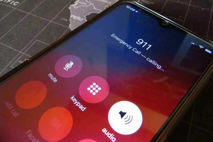 2326378557 Phone screen showing 911 emergency call in progress.