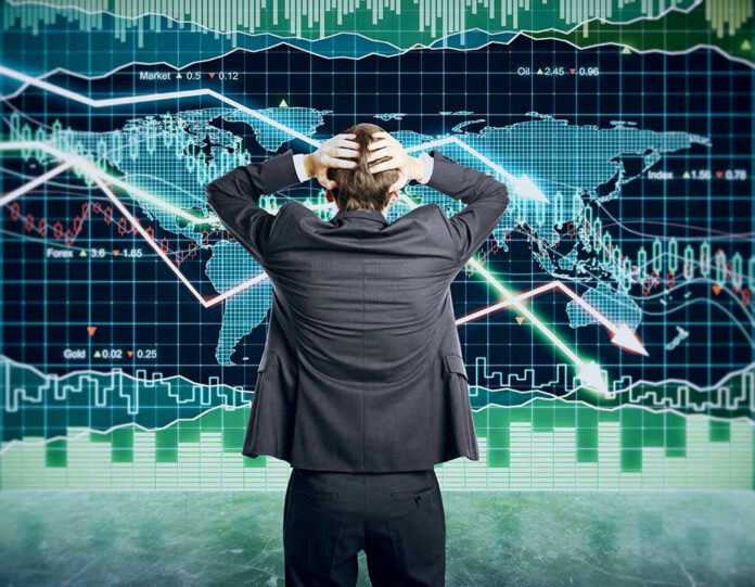 351140789 Person in front of falling stock market graph.