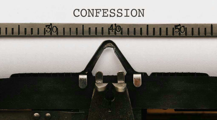 Typewriter with CONFESSION on paper.