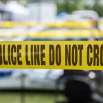 Work Zone Horror—Driver Vanishes After Mangling Dad Yellow police line tape with Do Not Cross.