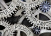 Gears labeled: rules, regulations, compliance, standards, policies.