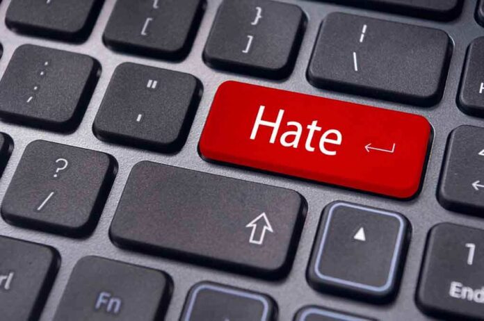 shutterstock_118178899.jpg Close-up of a keyboard with a red key labeled Hate