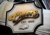 Brewery’s BIZARRE Loyalty Program – AUDACIOUS! Sign for Cheers bar established in 1895 featuring gold lettering and a hand gesture