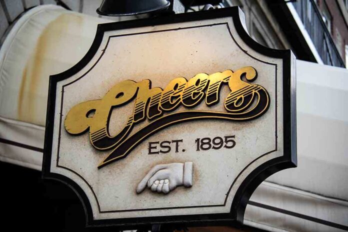Sign for Cheers bar established in 1895 featuring gold lettering and a hand gesture