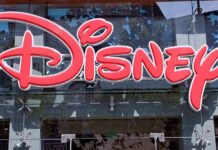 Bright red Disney logo displayed on a storefront window